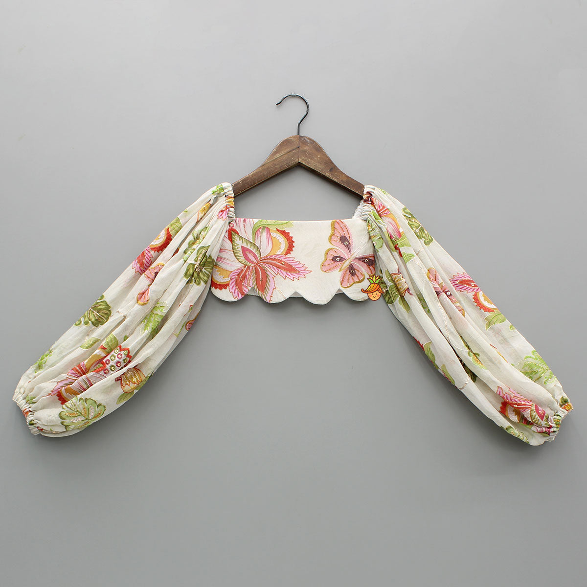 Pre Order: Beige Printed Embroidered Top And Umbrella Style Flared Lehenga With Matching Hairclip