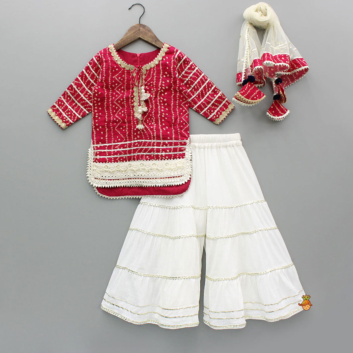Pre Order: Bandhani-Printed Pink Kurti With Off-White Sharara And Net Dupatta