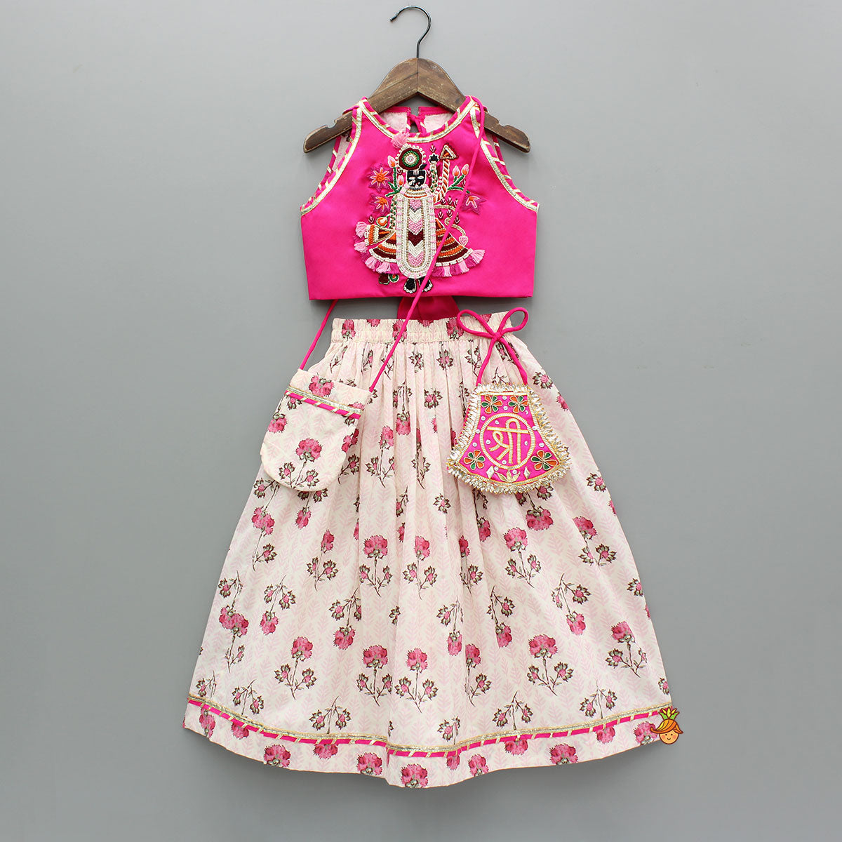 Pre Order: Goddess Embroidered Pink Top And Beautiful Tassels Embellished Lehenga With Matching Sling Bag