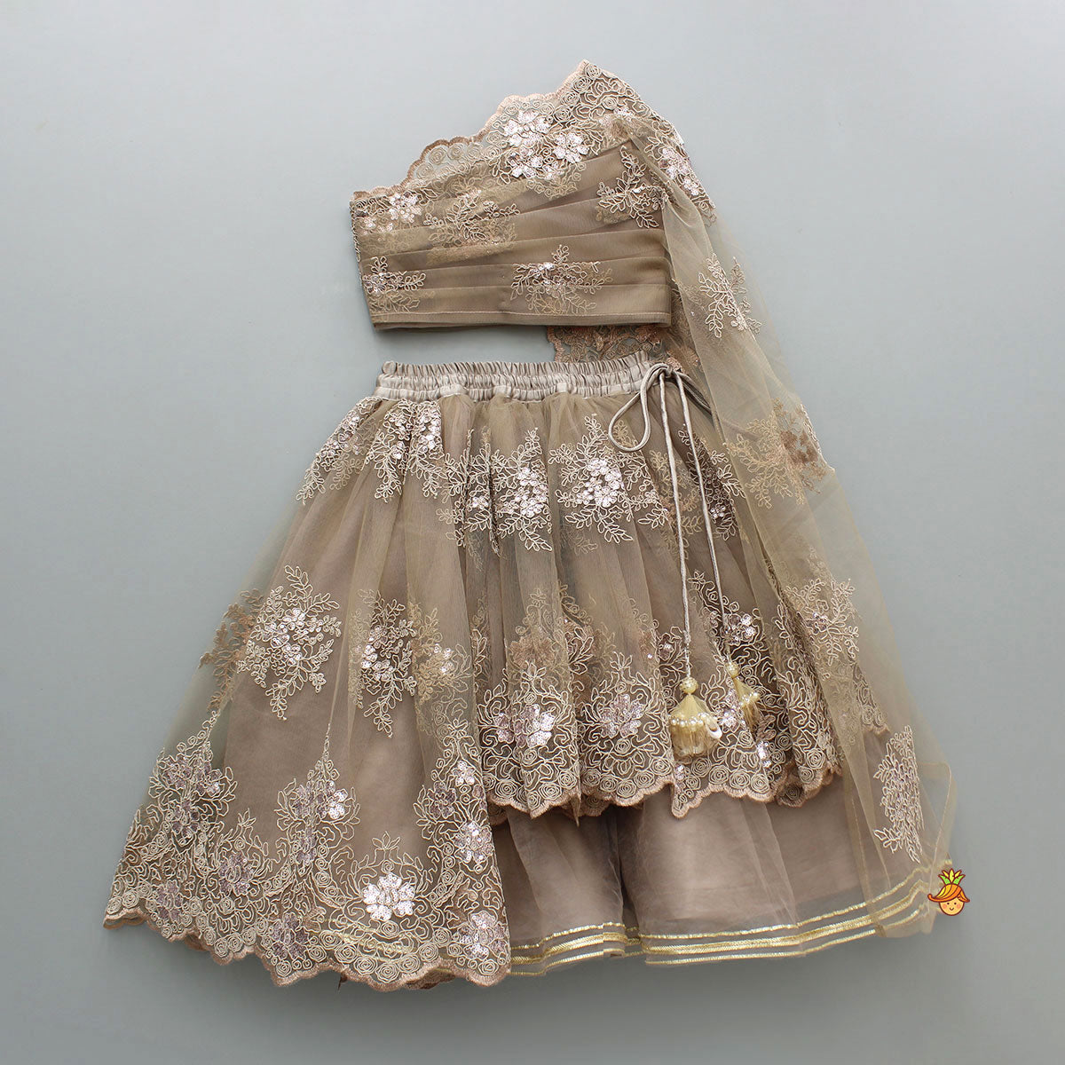 Pre Order: Exquisite Brown Embroidered One Shoulder Drape Top And Layered Lehenga