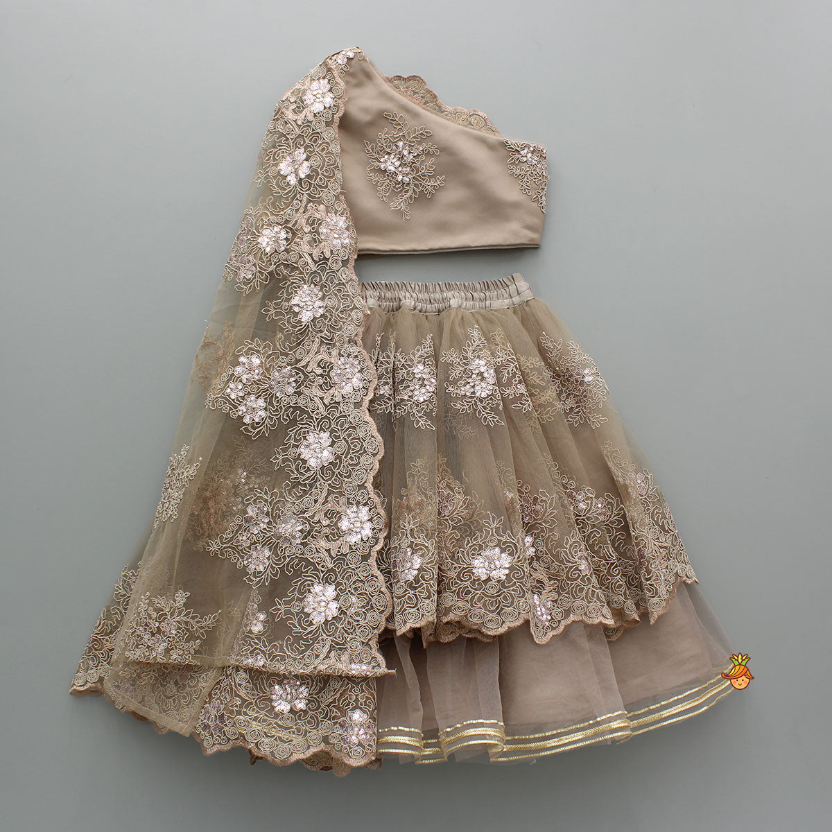 Pre Order: Exquisite Brown Embroidered One Shoulder Drape Top And Layered Lehenga