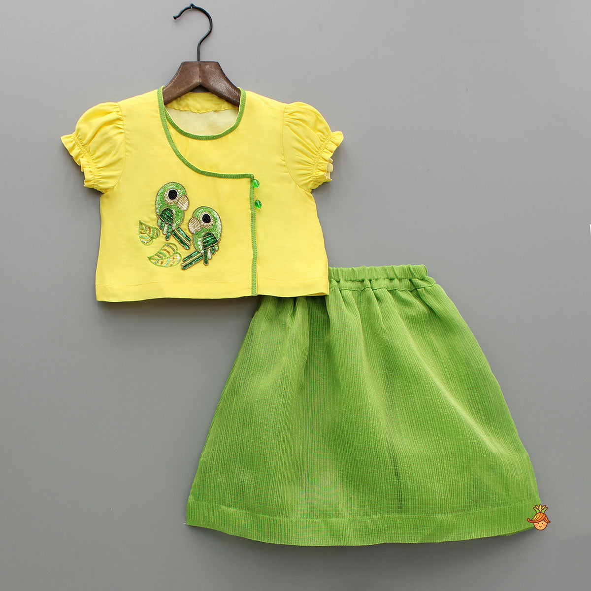 Pre Order: Angarkha Style Yellow Top And Green Lehenga