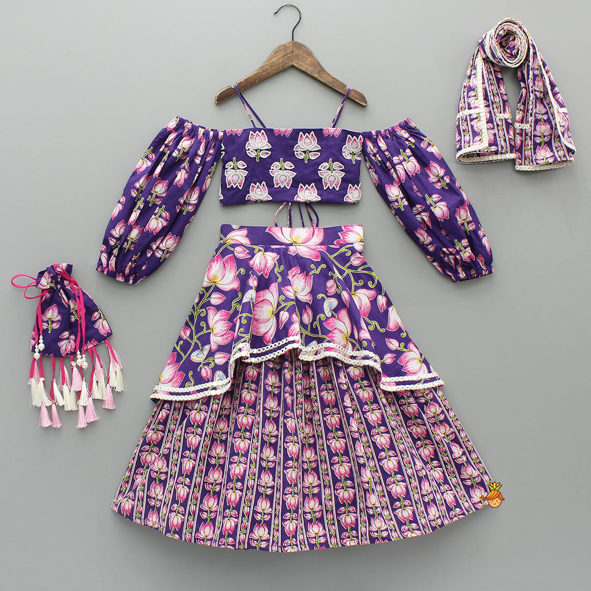 Pre Order: Lotus Embroidered Top And Layered Lehenga With Dupatta And Fringed Potli Bag