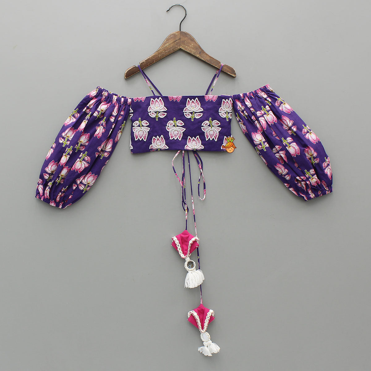 Pre Order: Lotus Embroidered Top And Layered Lehenga With Dupatta And Fringed Potli Bag