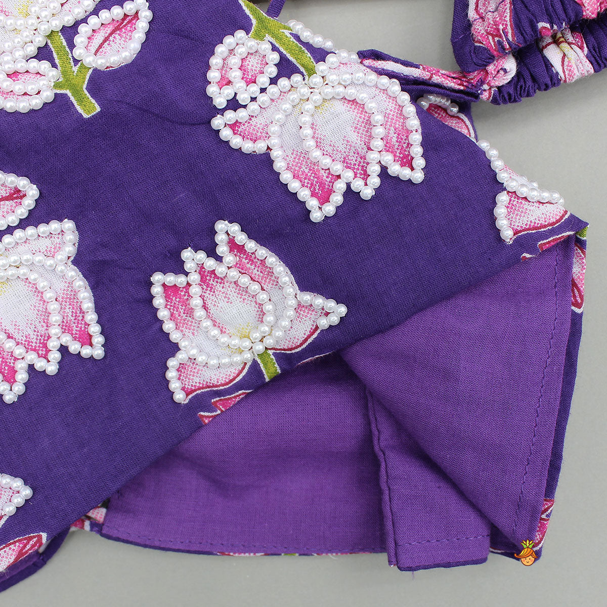 Pre Order: Lotus Embroidered Top And Layered Lehenga With Dupatta And Fringed Potli Bag