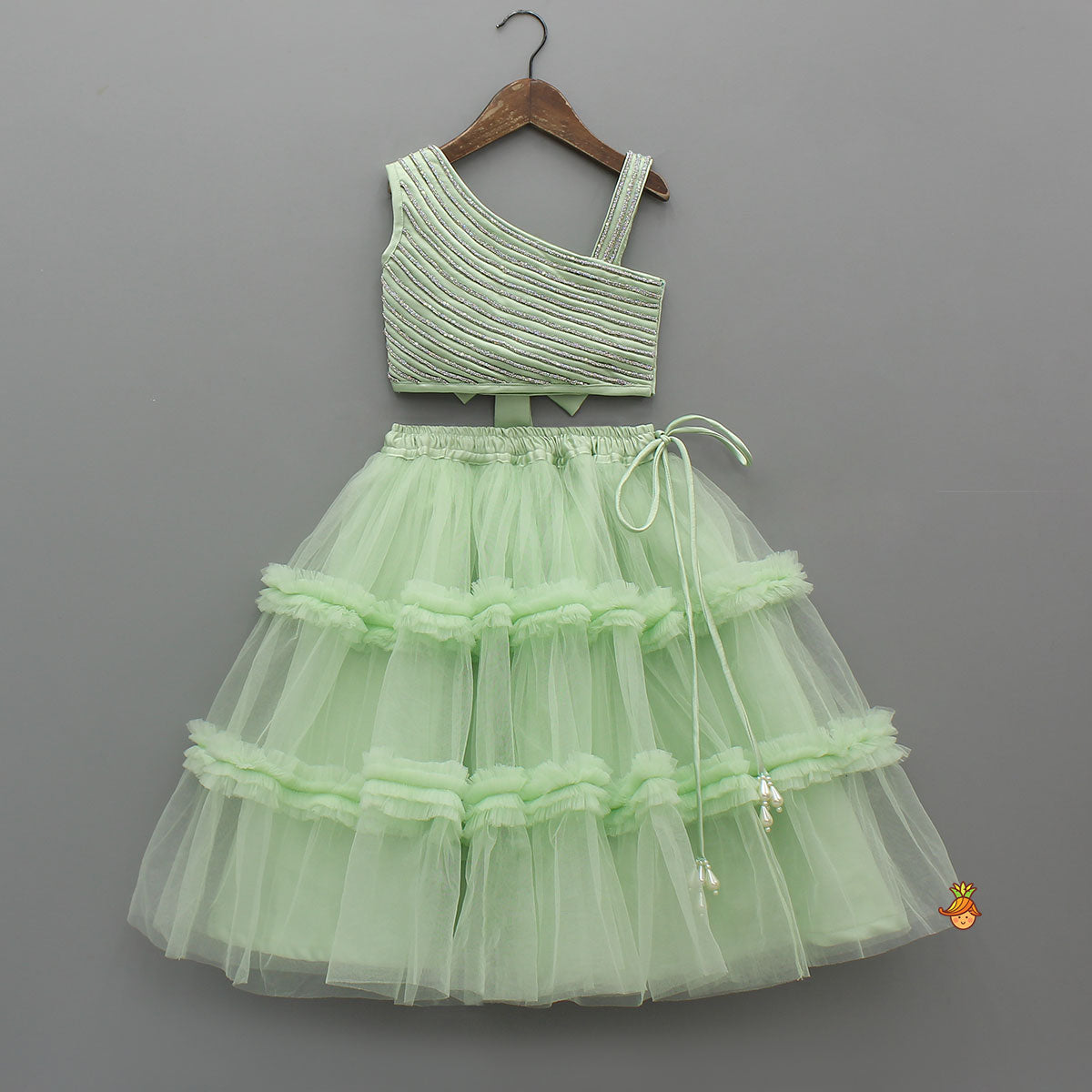 Pre Order: Shiny Lace Work One Shoulder Top And Ruffle Lehenga