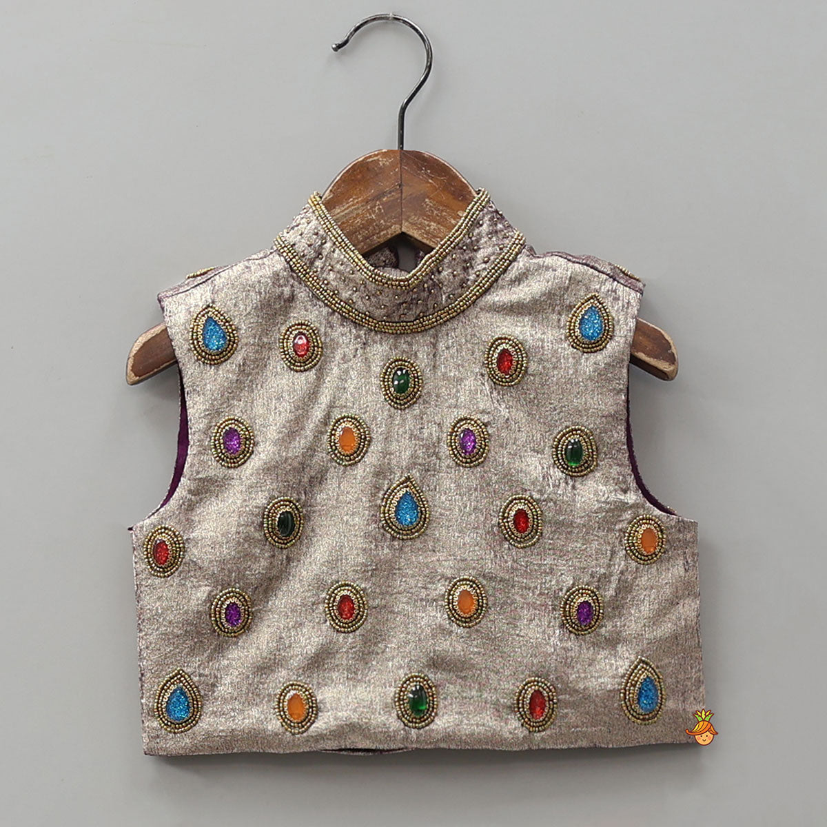 Pre Order: Sleeveless Shiny Top With Layered Lehenga And Attached Dupatta