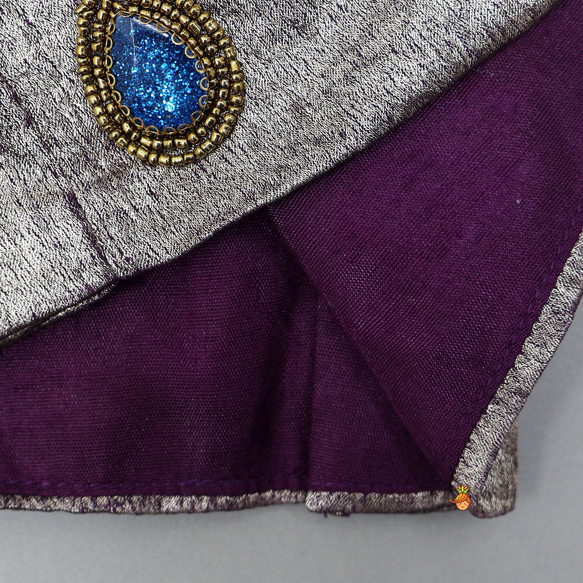 Pre Order: Sleeveless Shiny Top With Layered Lehenga And Attached Dupatta