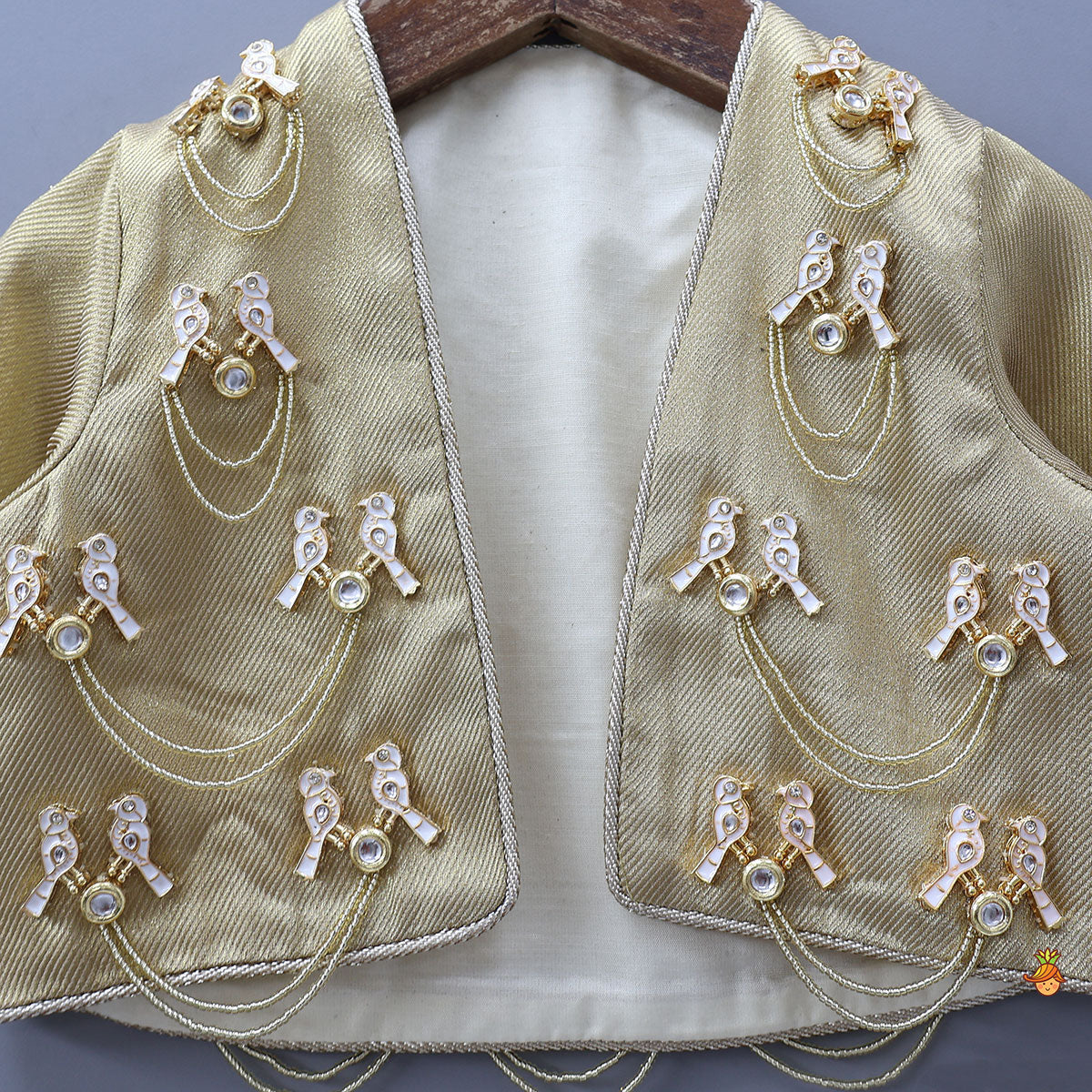 Pre Order: Exquisite Halter Neck Brocade Top With Embellished Jacket And Brocade Lehenga With Matching Hair Band