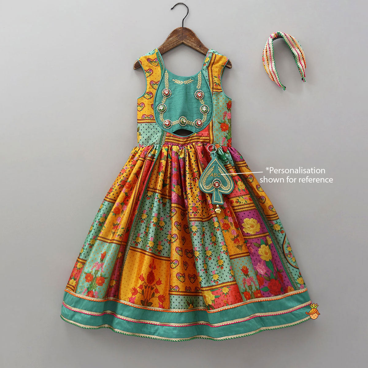 Elegant Multicolour Printed Sleeveless Dress With Attached Bag And Matching Hairband