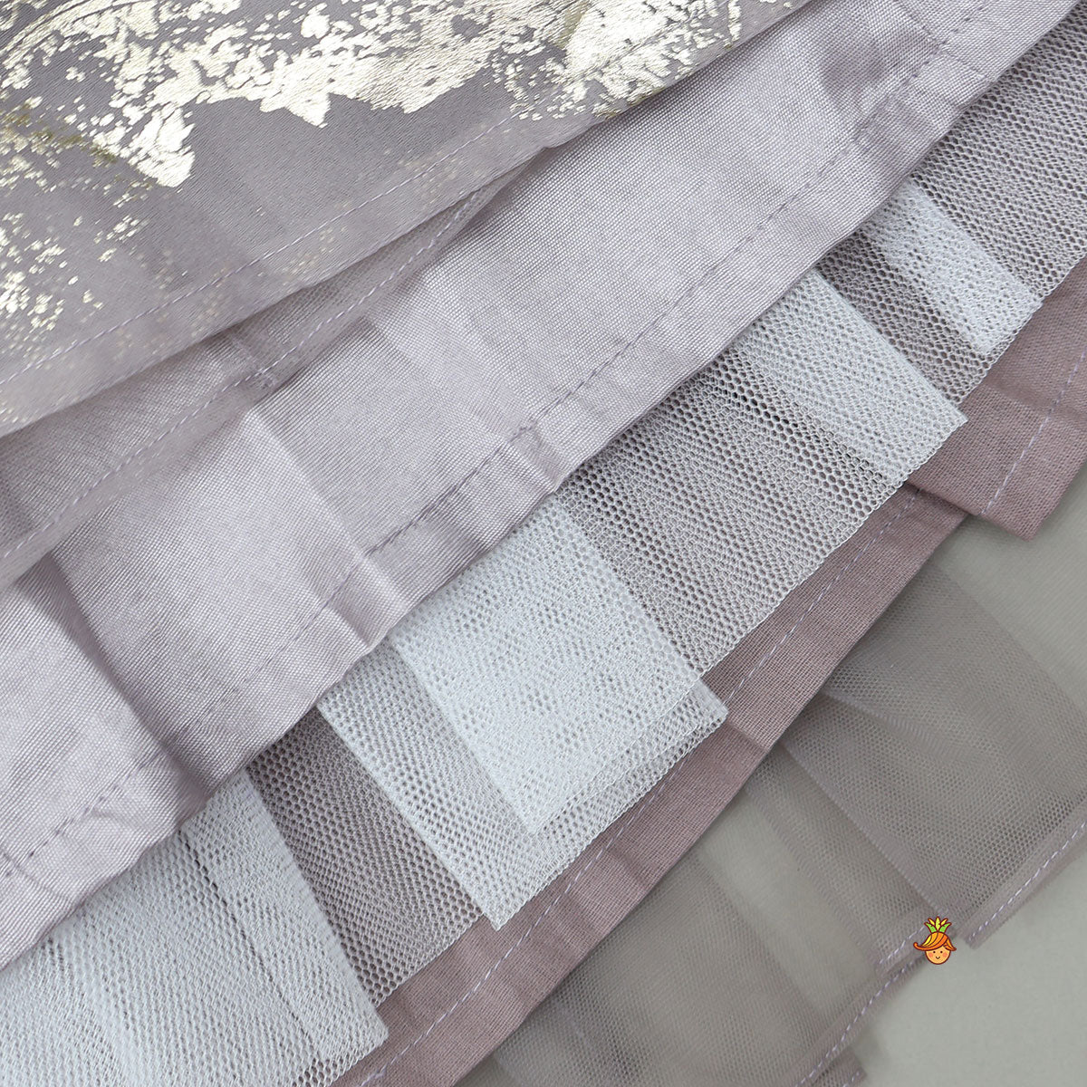 Pre Order: V-Neck Foil Printed Top And Layered Lehenga