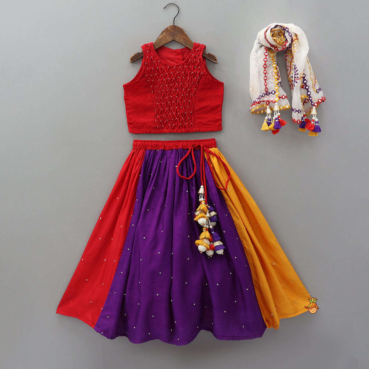 Pre Order: Elegant Top And Multi-Panel Colour-Block Lehenga With Mirror Work Dupatta