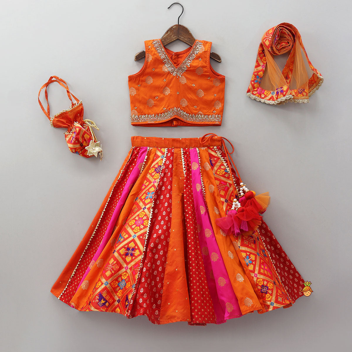 Pre Order: Embroidered Elegant Top And Brocade Lehenga With Matching Net Dupatta And Brocade Potli Bag