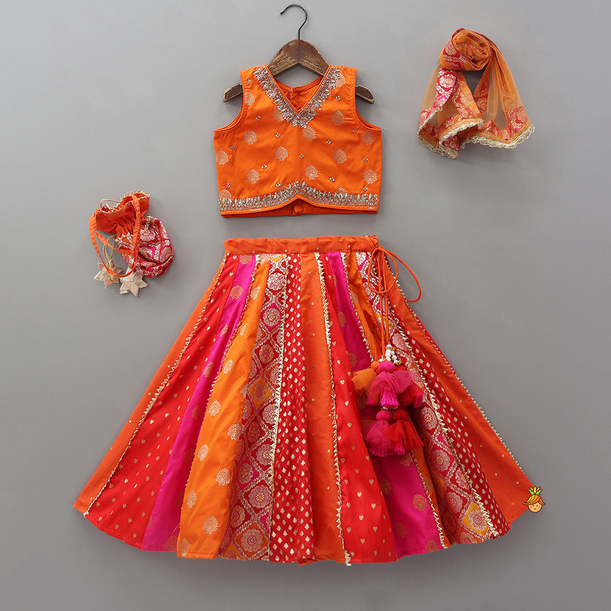 Pre Order: Embroidered Elegant Top And Brocade Lehenga With Matching Net Dupatta And Brocade Potli Bag