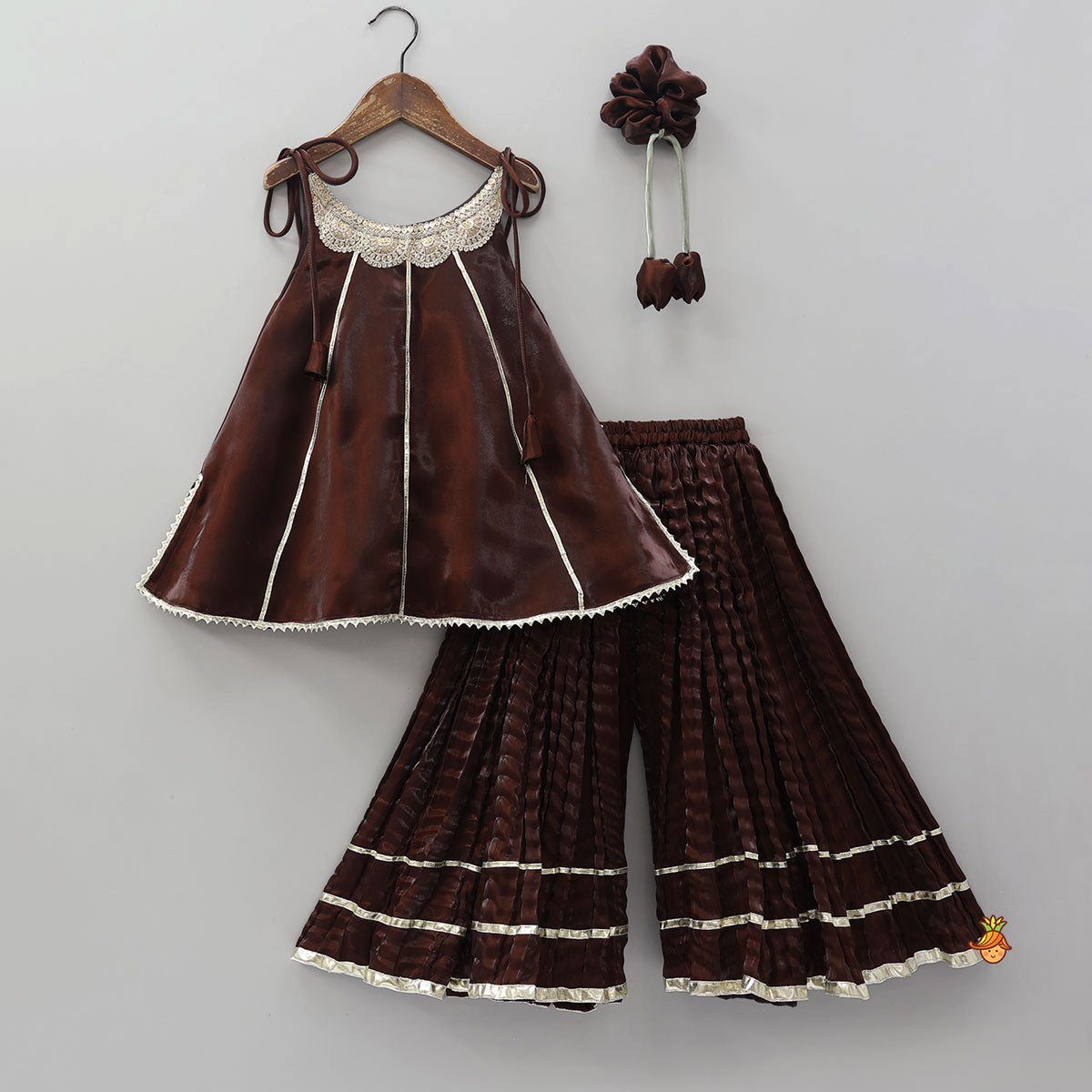 Pre Order: Sleeveless Sheen Kurti And Crushed Fabric Palazzo With Hair Tie