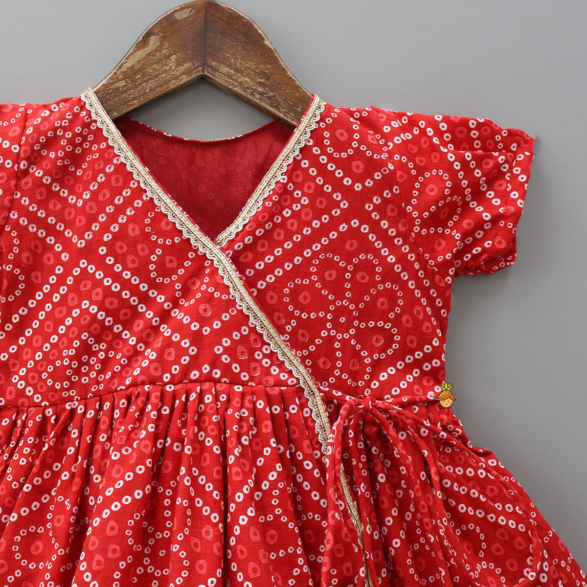 Pre Order: Bandhani Printed Angarkha Style Kurti With Cap Mittens And Booties