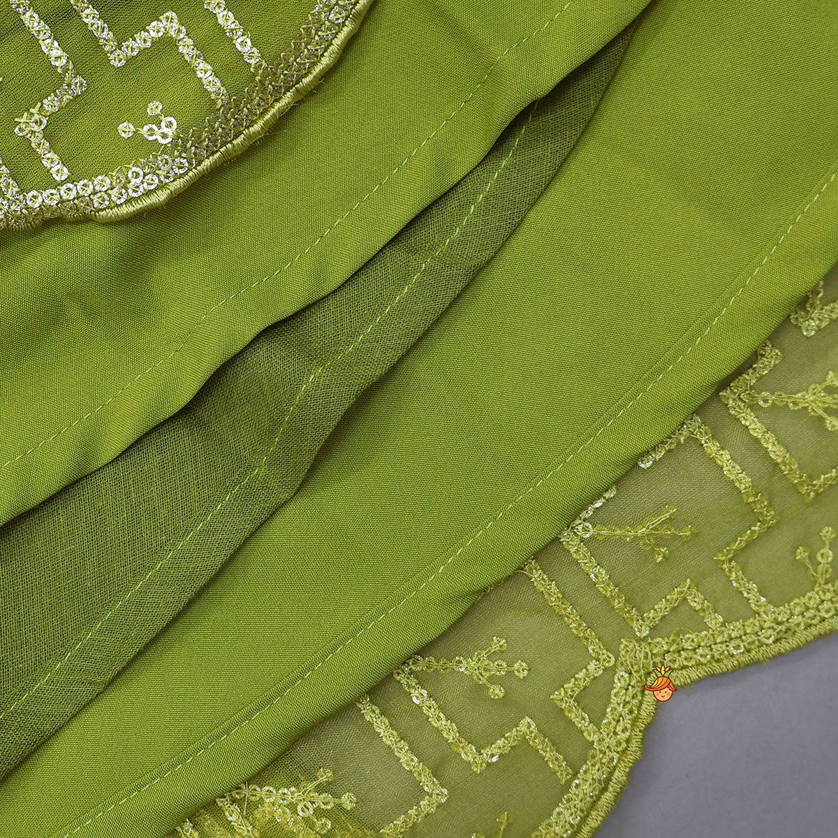 Pre Order: Organza Top And Lehenga With Handmade Tassel Detailing