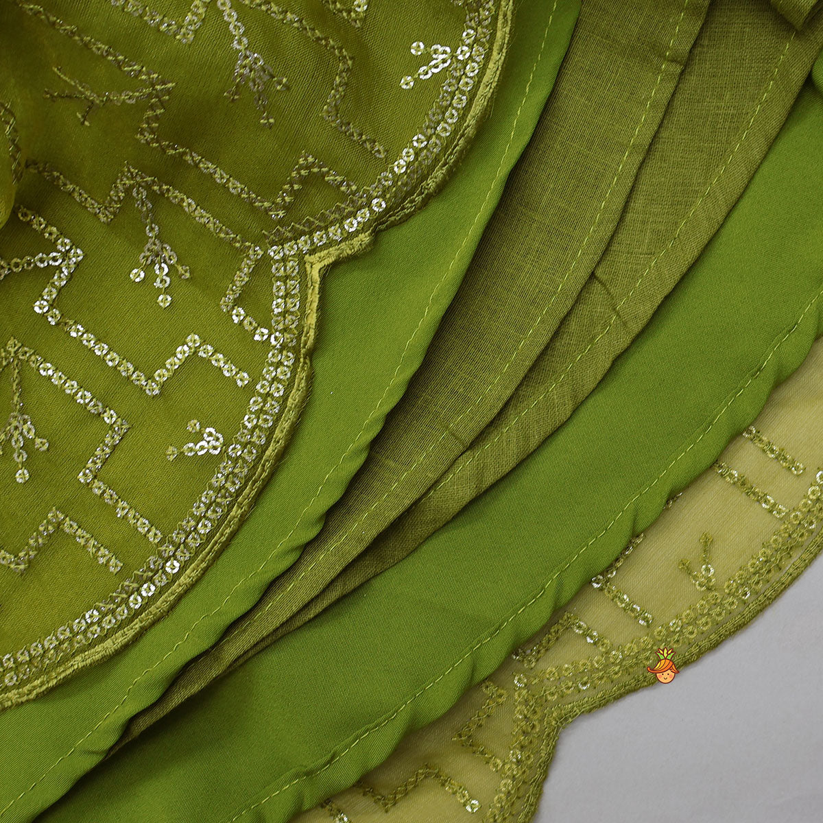 Pre Order: Organza Top And Lehenga With Handmade Tassel Detailing