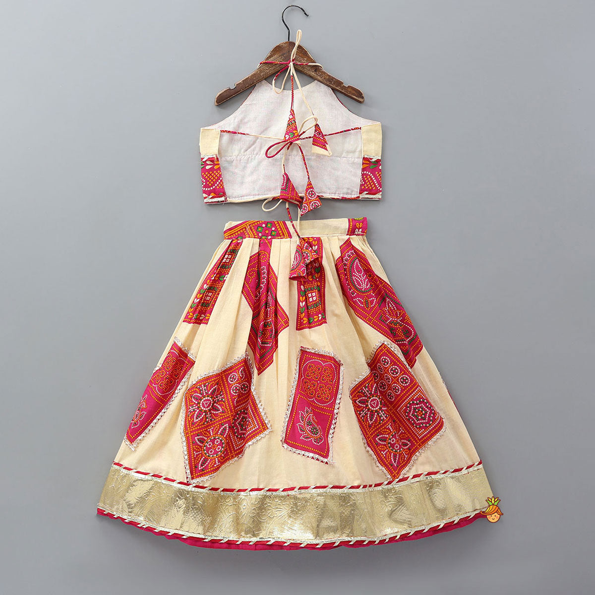 Pre Order: Tie-Up Back Bandhani-Printed Top And Lehenga