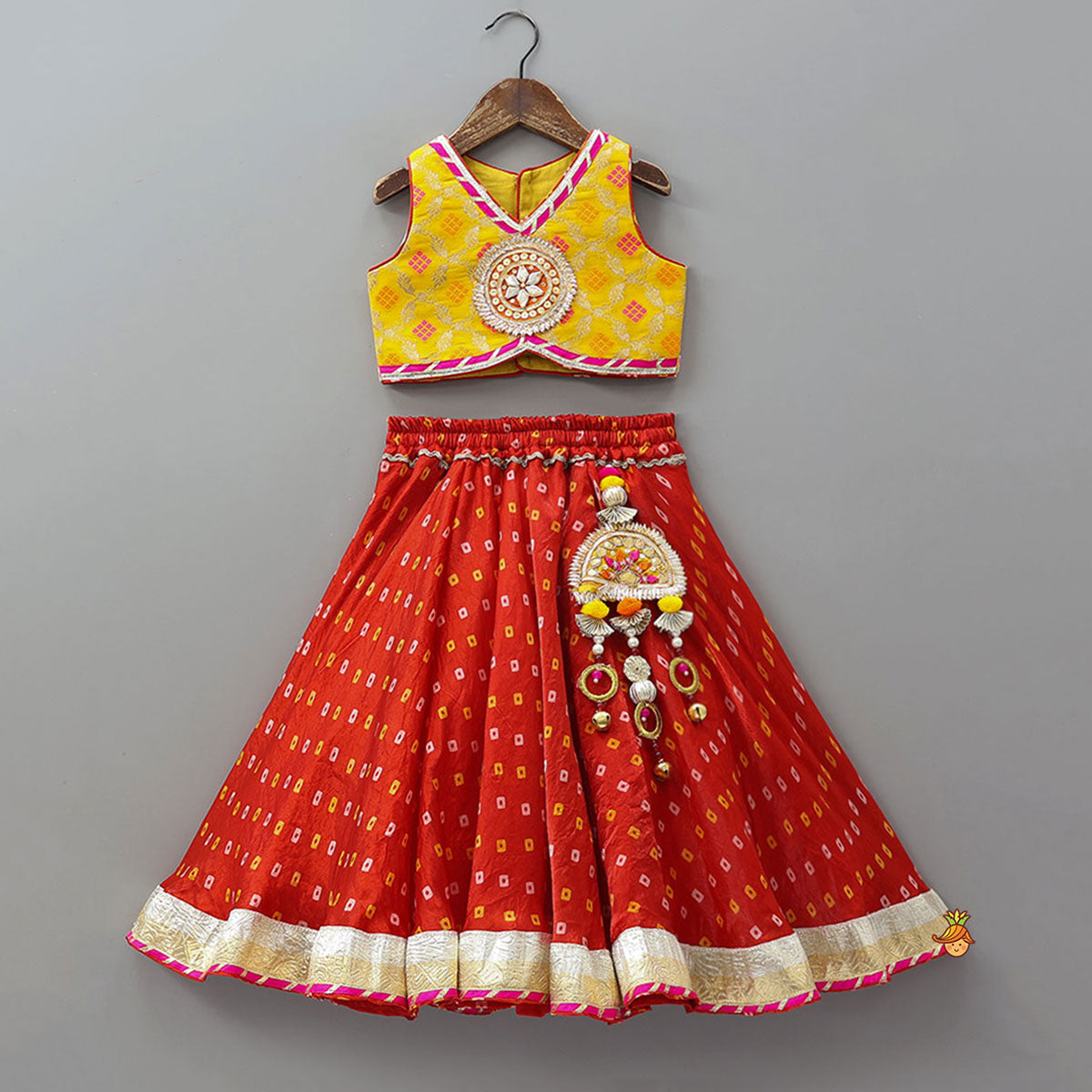 Pre Order: Stunning Crop Top And Tassel Detailed Bandhani Printed Sheen Lehenga With Dupatta
