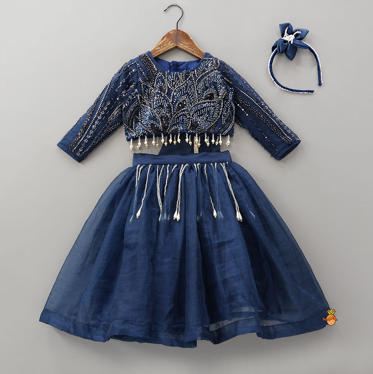 Pre Order: Heavy Embroidered Drape Crop Top And Lehenga With Matching Hair Band