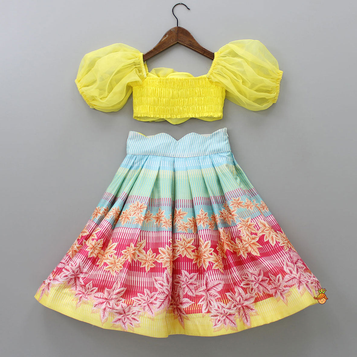 Pre Order: Scalloped Neck Yellow Organza Top And Printed Lehenga With Floral Sling Bag