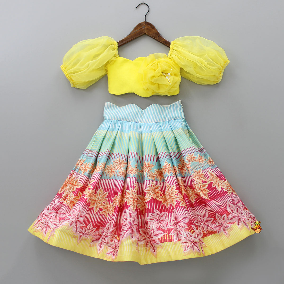 Pre Order: Scalloped Neck Yellow Organza Top And Printed Lehenga With Floral Sling Bag